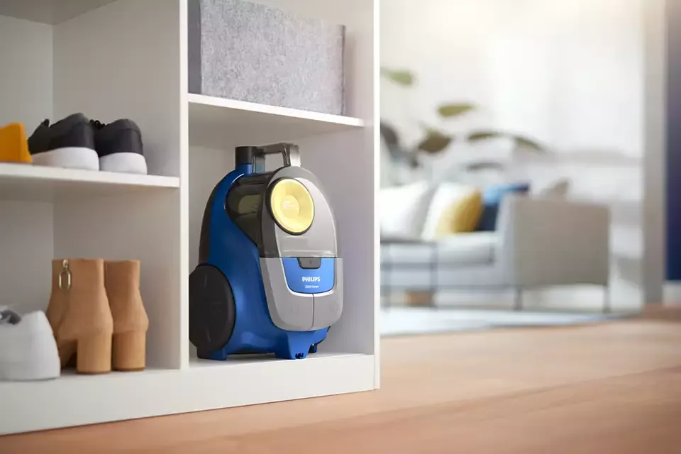 Пилосос Philips, контейнерний, серії 2000, потужність 850 Вт, об'єм контейнера 1,3 л, мікрофібровий фільтр, синьо-жовтого кольору.