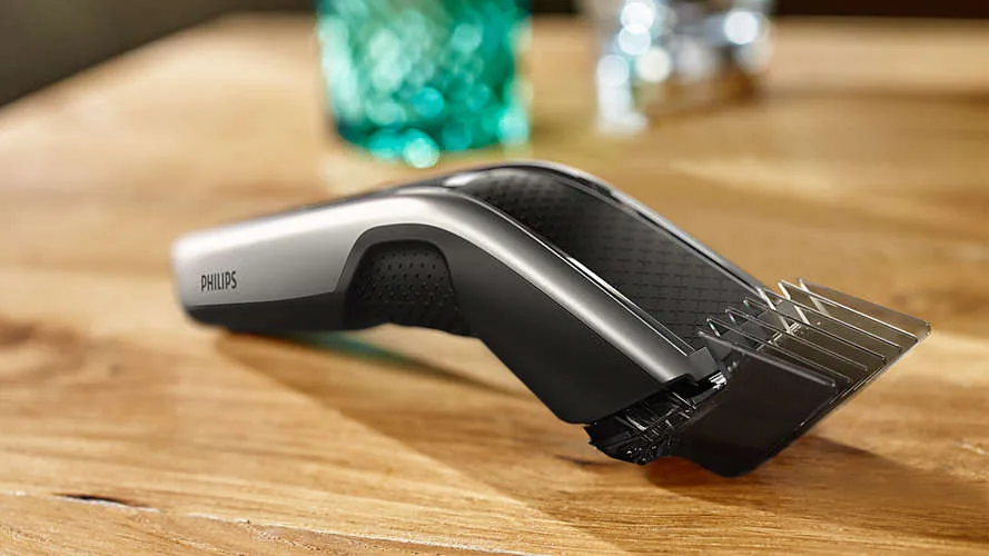 Тример для волосся Philips Series 5000, акумуляторний, роторний двигун, 2 насадки, кейс, сталь, чорний з сірим.
