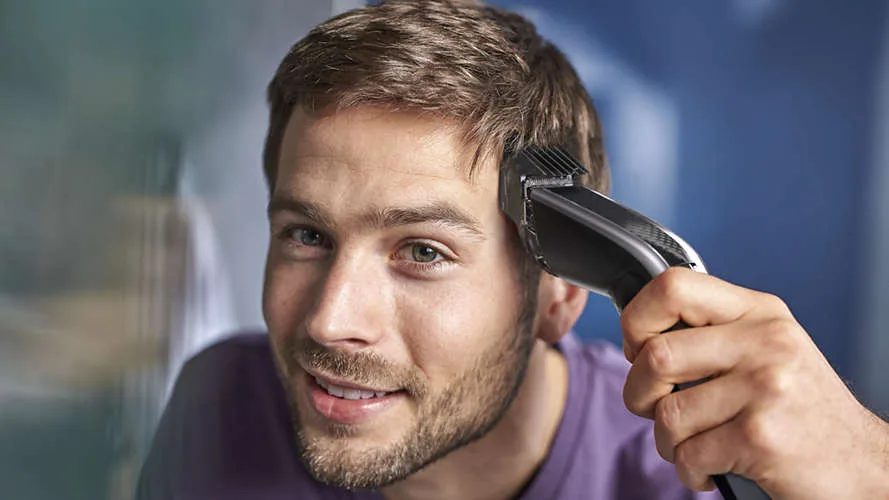 Тример для волосся Philips Series 5000, акумуляторний, роторний двигун, 2 насадки, кейс, сталь, чорний з сірим.