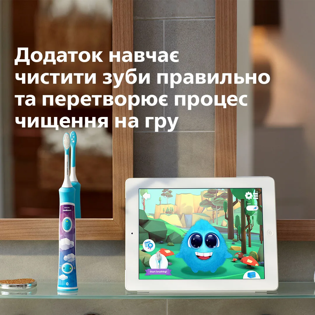 Зубна електрощітка Philips для дітей акумуляторна 2 насадки пульсуюча біла