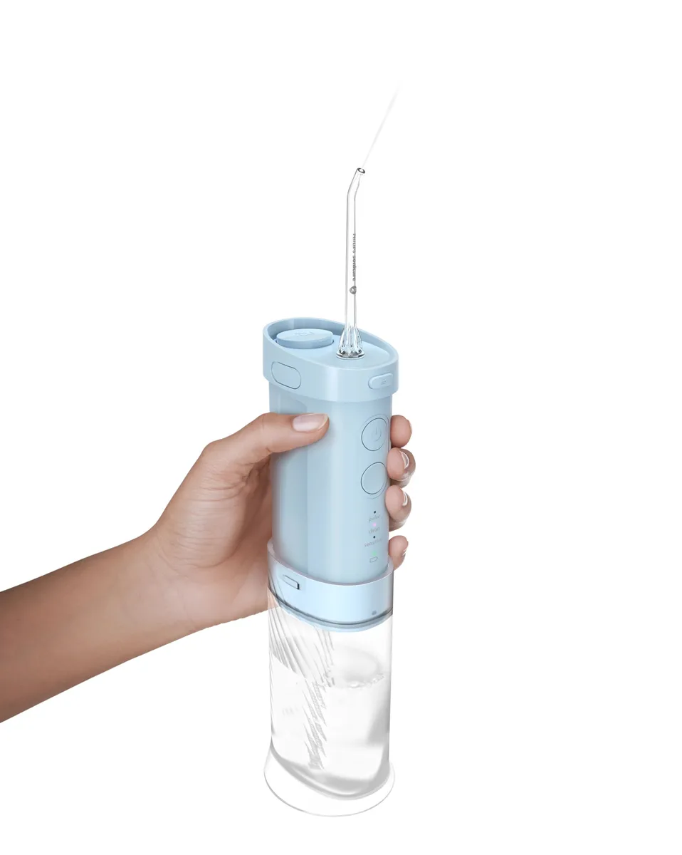 Іригатор Philips Sonicare Compact Flosser 1000, портативний, з чашею 200 мл, складний, блакитний.
