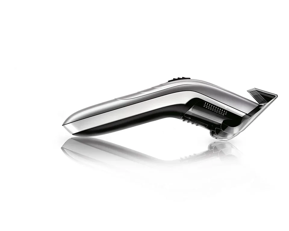 Акумуляторна машинка для стрижки Philips з роторним мотором, виготовлена зі сталі, сріблястого кольору.