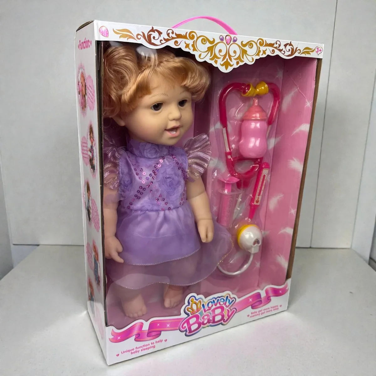 Дитяча динамічна лялька Lovely Baby інерційна з пляшкою пластикова 44х32х13 см рожевий