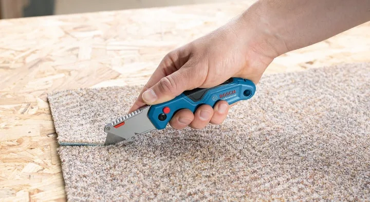 Складаний трапецієподібний будівельний ніж Bosch Professional, пластиковий корпус, 215 мм.